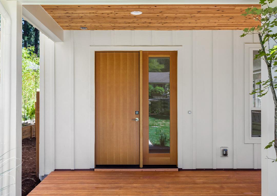 front entry door and white siding